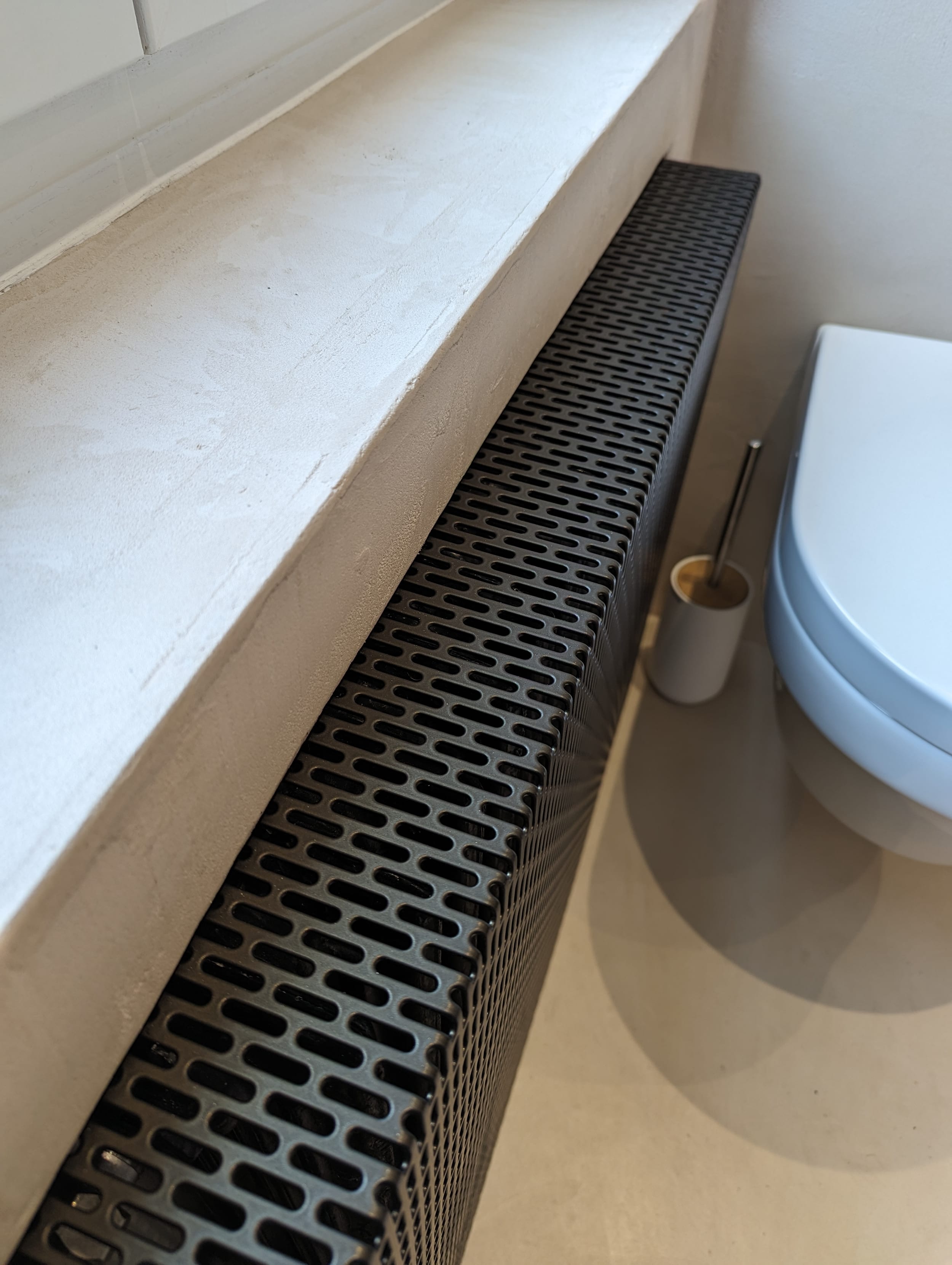 Cache radiateur en tôle perforée